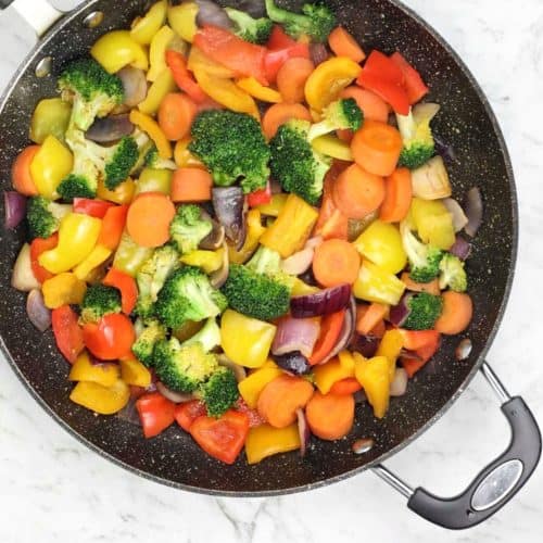 cooked vegetables in a frying pan.