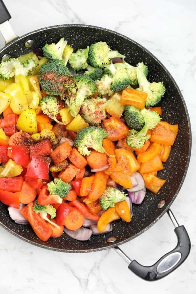 vegetables and seasoning in frying pan.