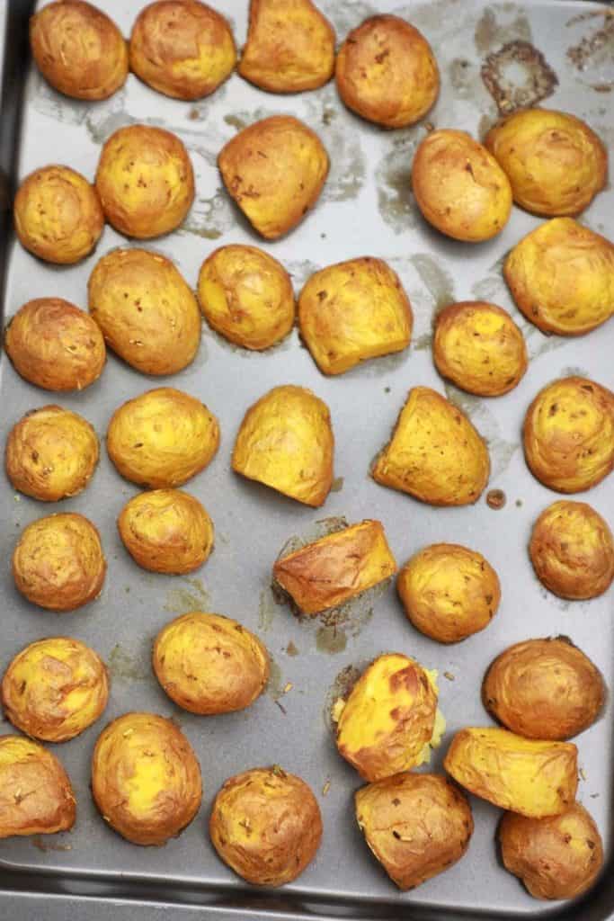 baked baby potatoes on a baking tray.