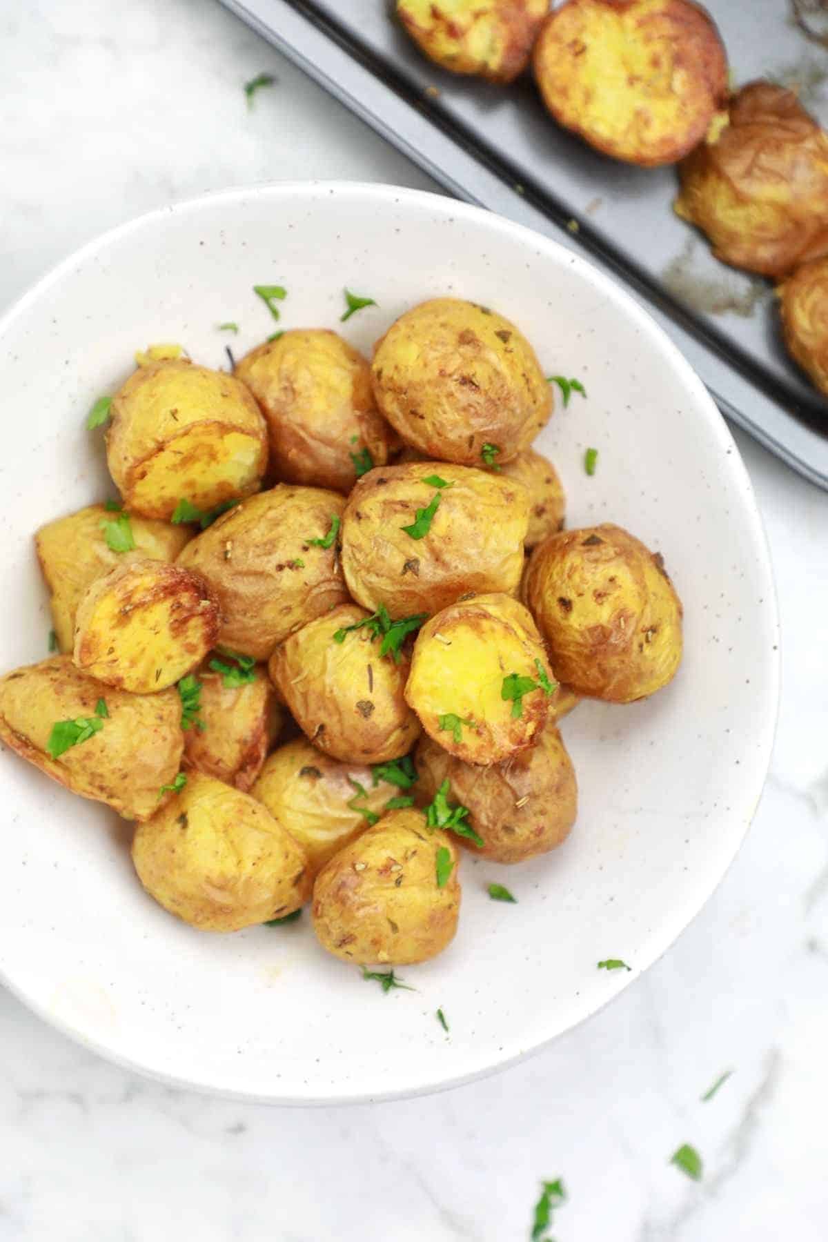 roasted baby potatoes served on a plate.