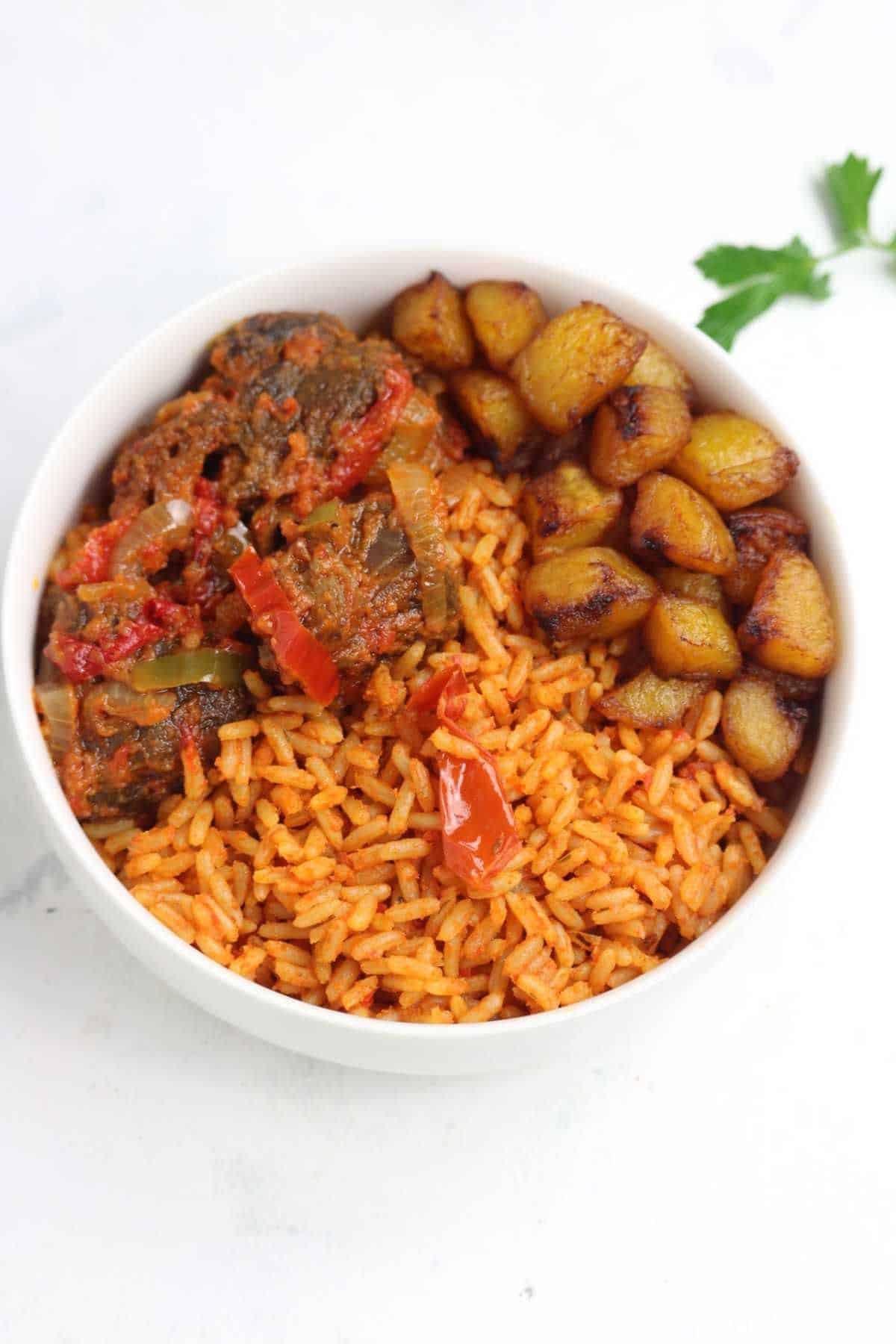served with fried plantain and beef.