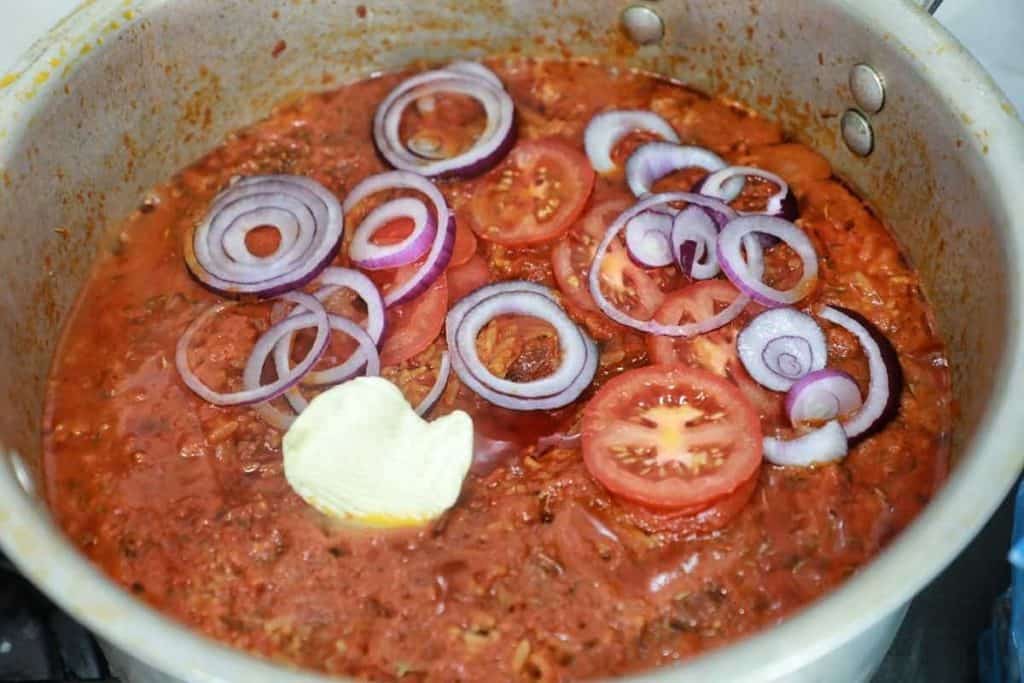sliced onions, tomato, and butter added.