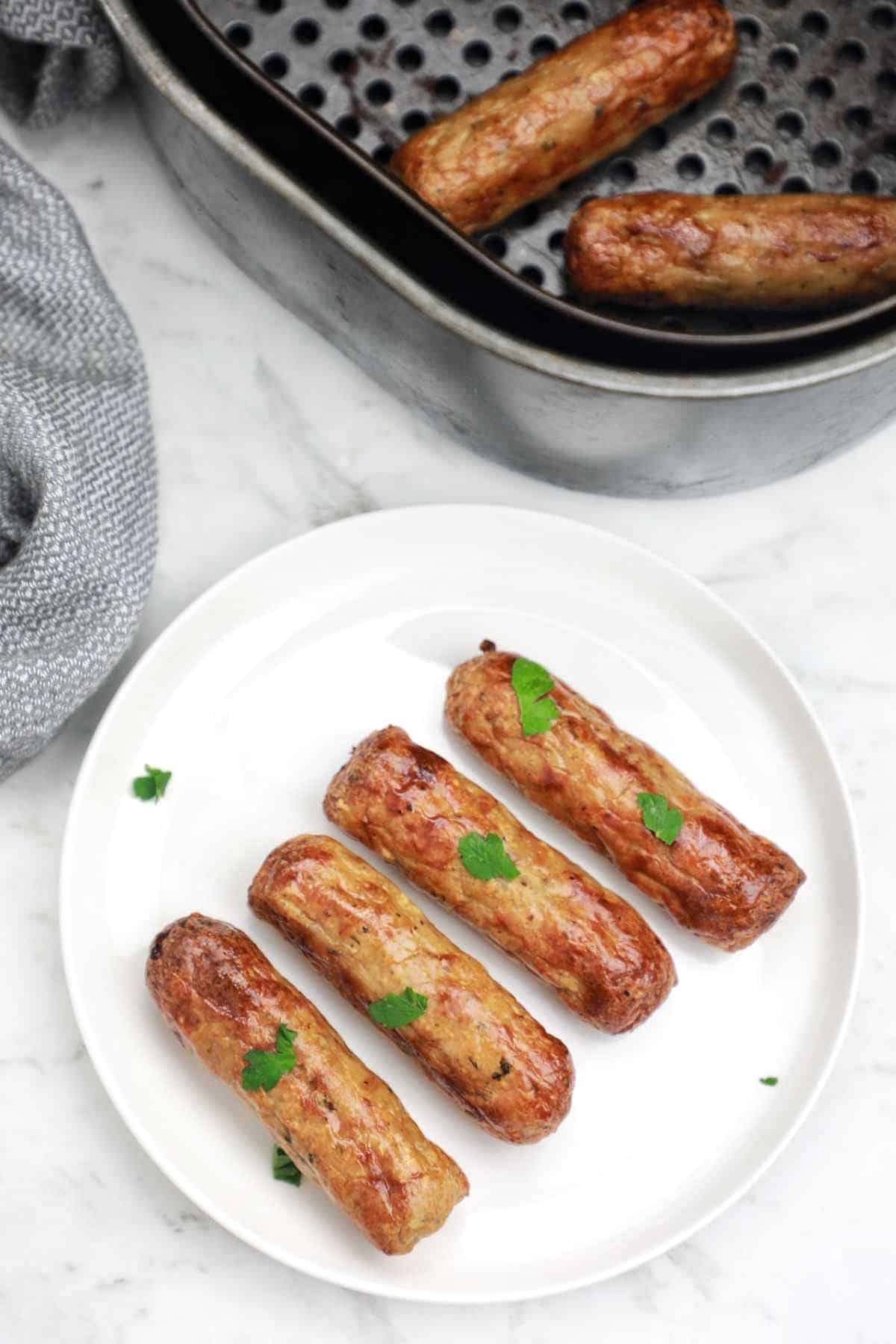 sausages on a plate and in air fryer.