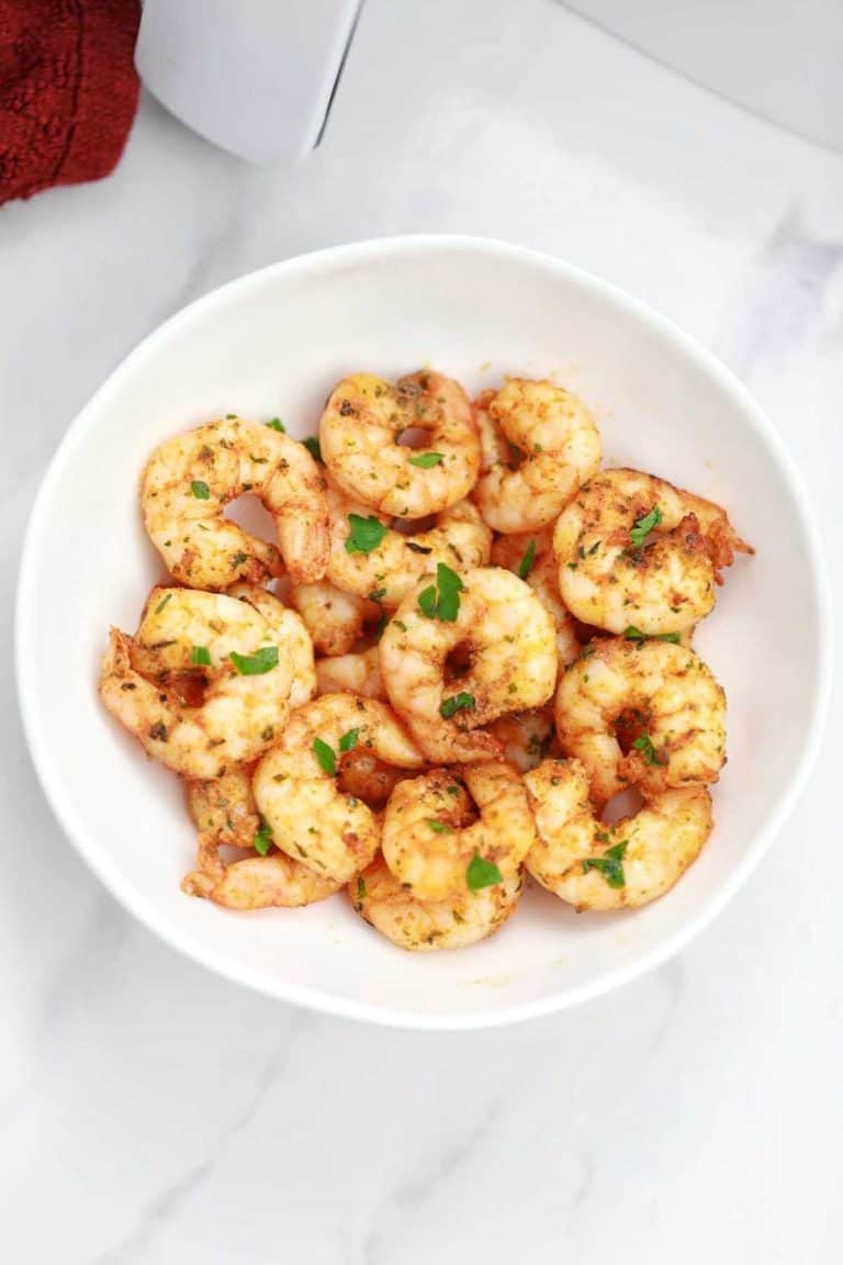 air fryer shrimp served and garnished with parsley.