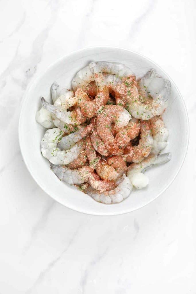 seasoning and shrimps in a bowl.