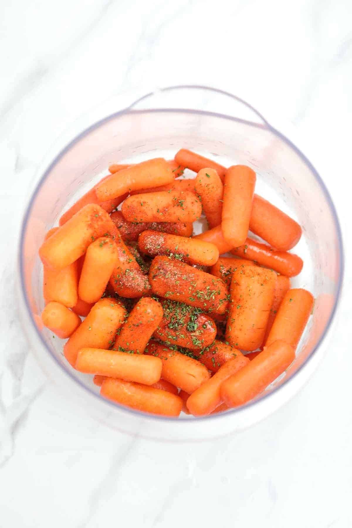 carrots and seasoning in a bowl.