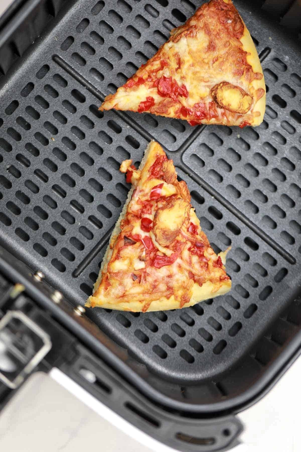 2 slices leftover pizza in the air fryer.