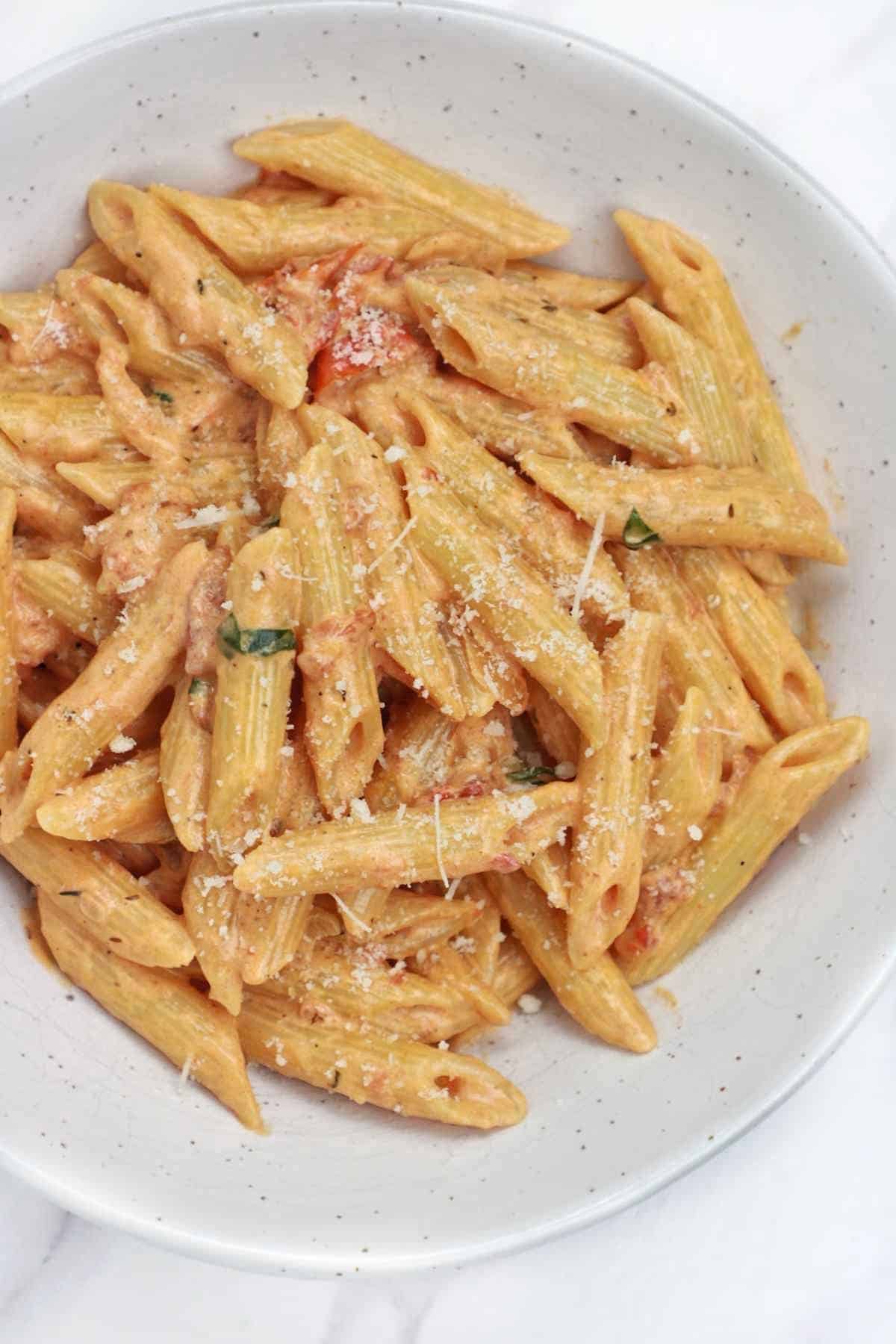 tomato pasta served with parmesan.