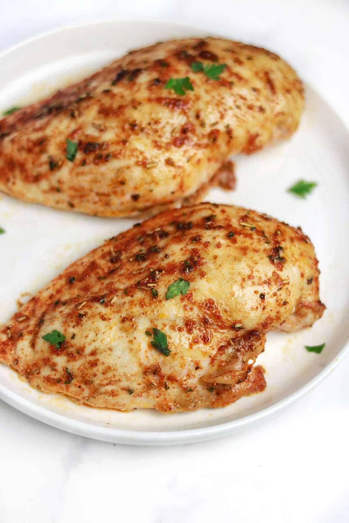 baked frozen chicken breast served on a plate.