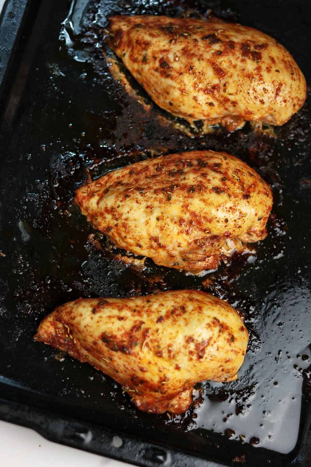 3chicken breast on a baking tray.
