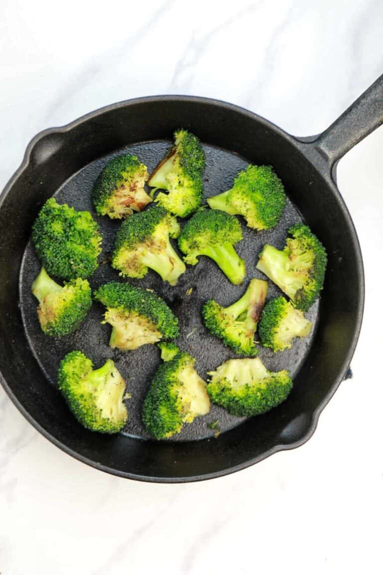pan fried broccoli in a skillet.