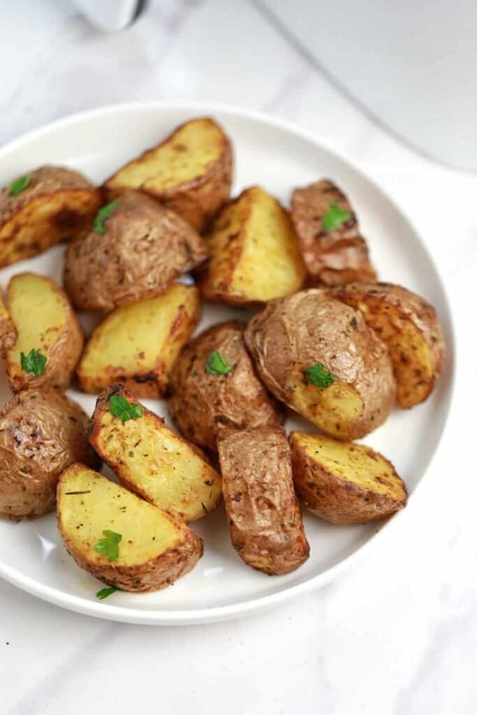Air fryer red potatoes served on a white plate.
