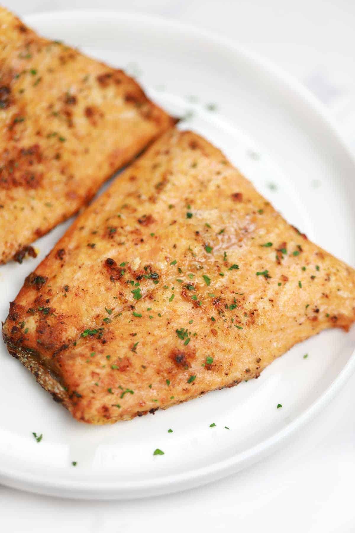 Air fryer frozen salmon cooked and served.