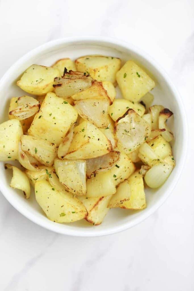 air fryer potatoes and onions served.