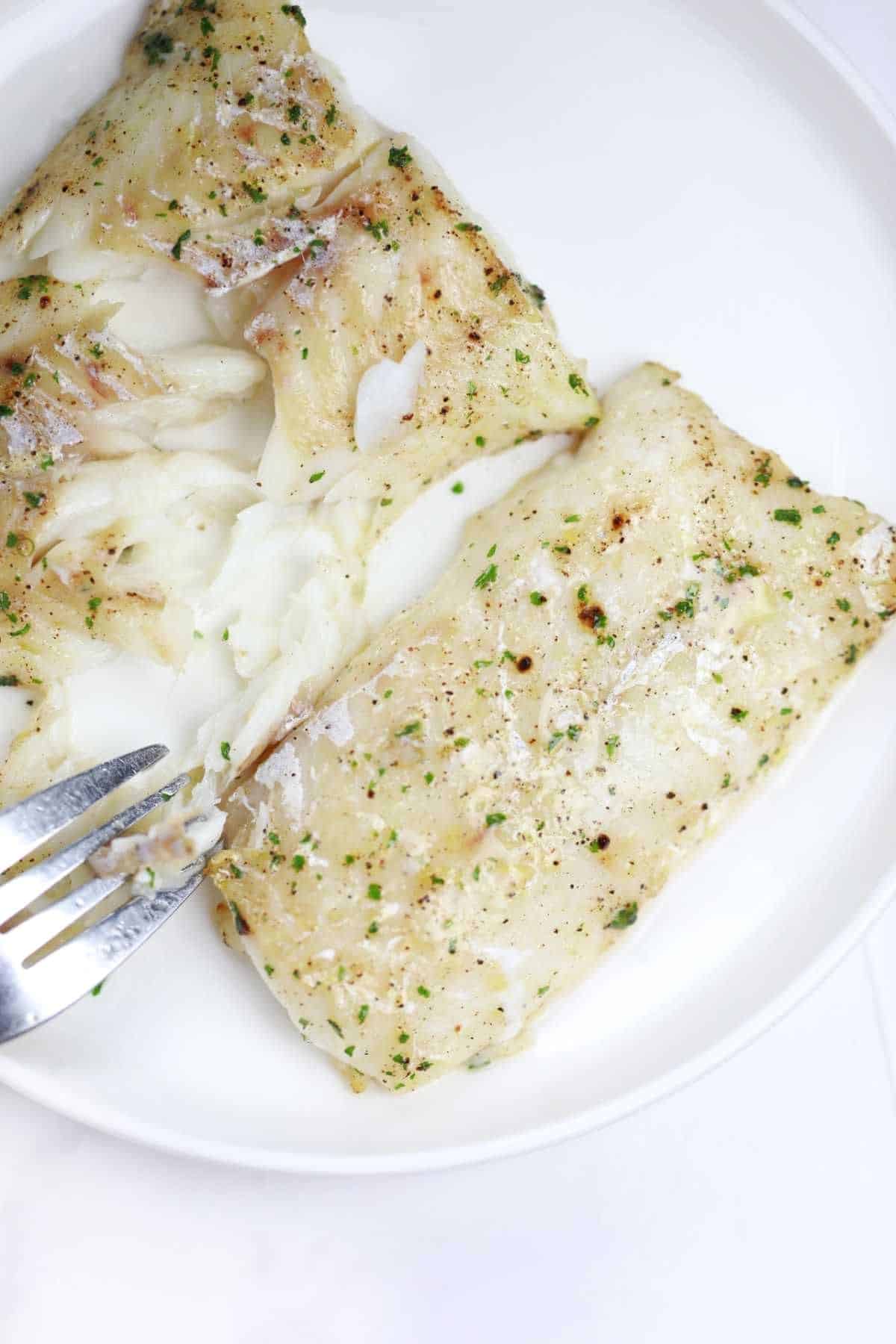 air fryer frozen cod cooked and served.