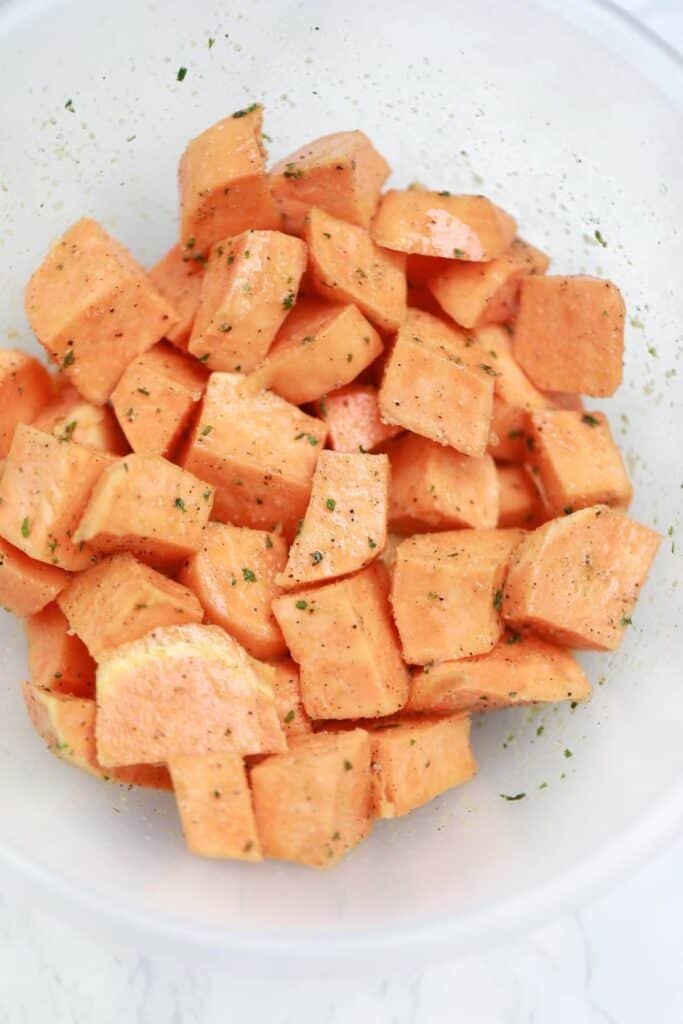 seasoned sweet potato cubes in a bowl.