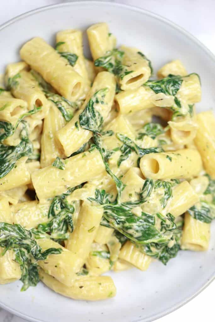 pasta with spinach served on a plate.