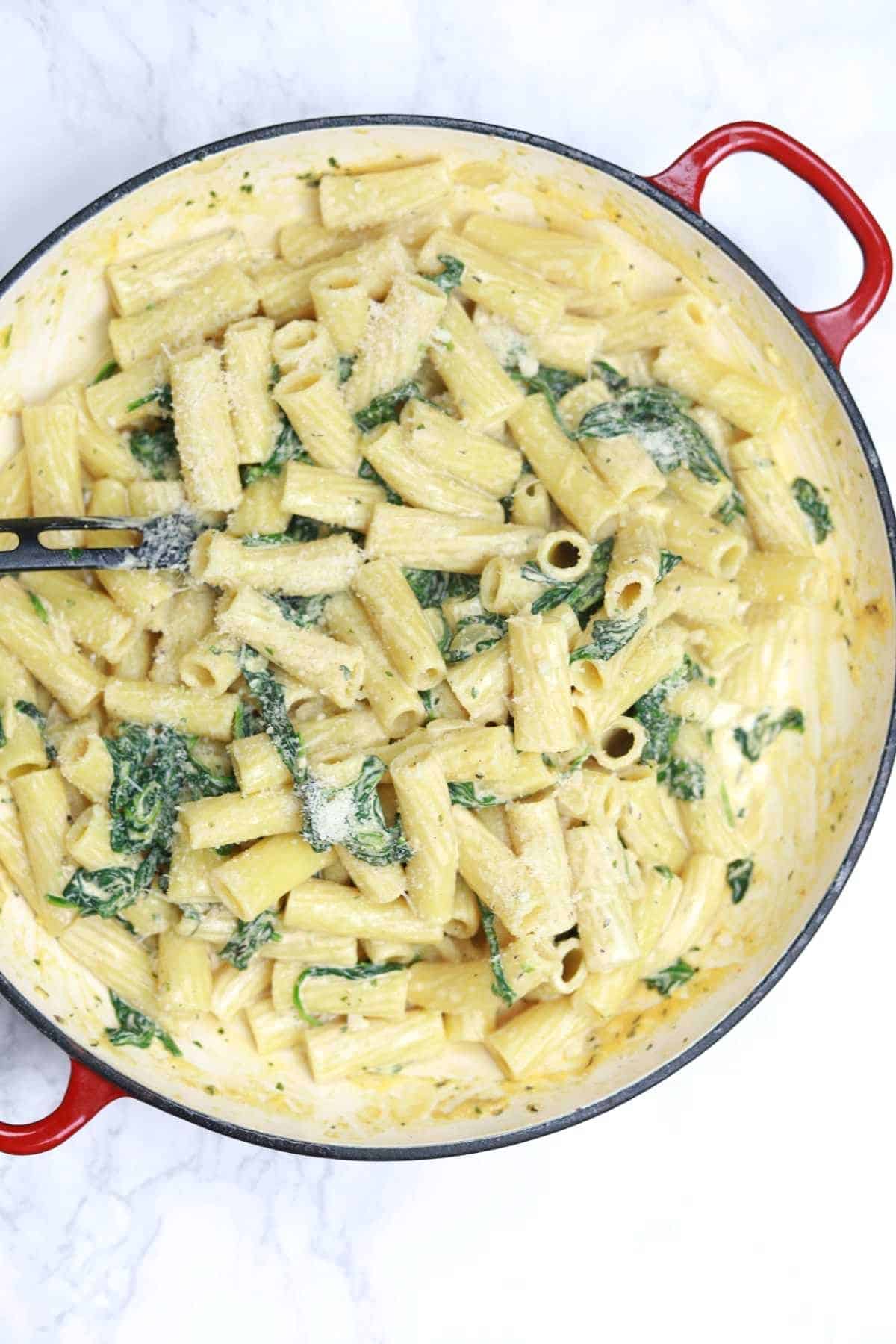 pasta with spinach in a pot.