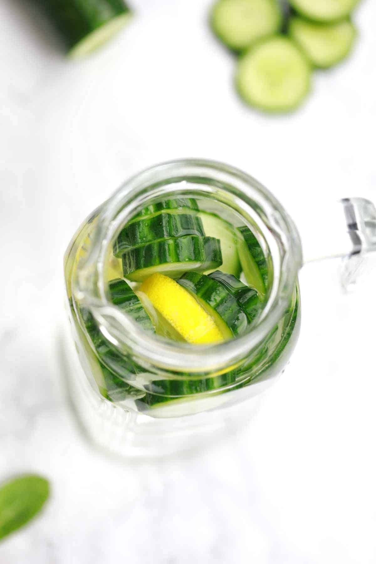 cucumber infused water in a jug.
