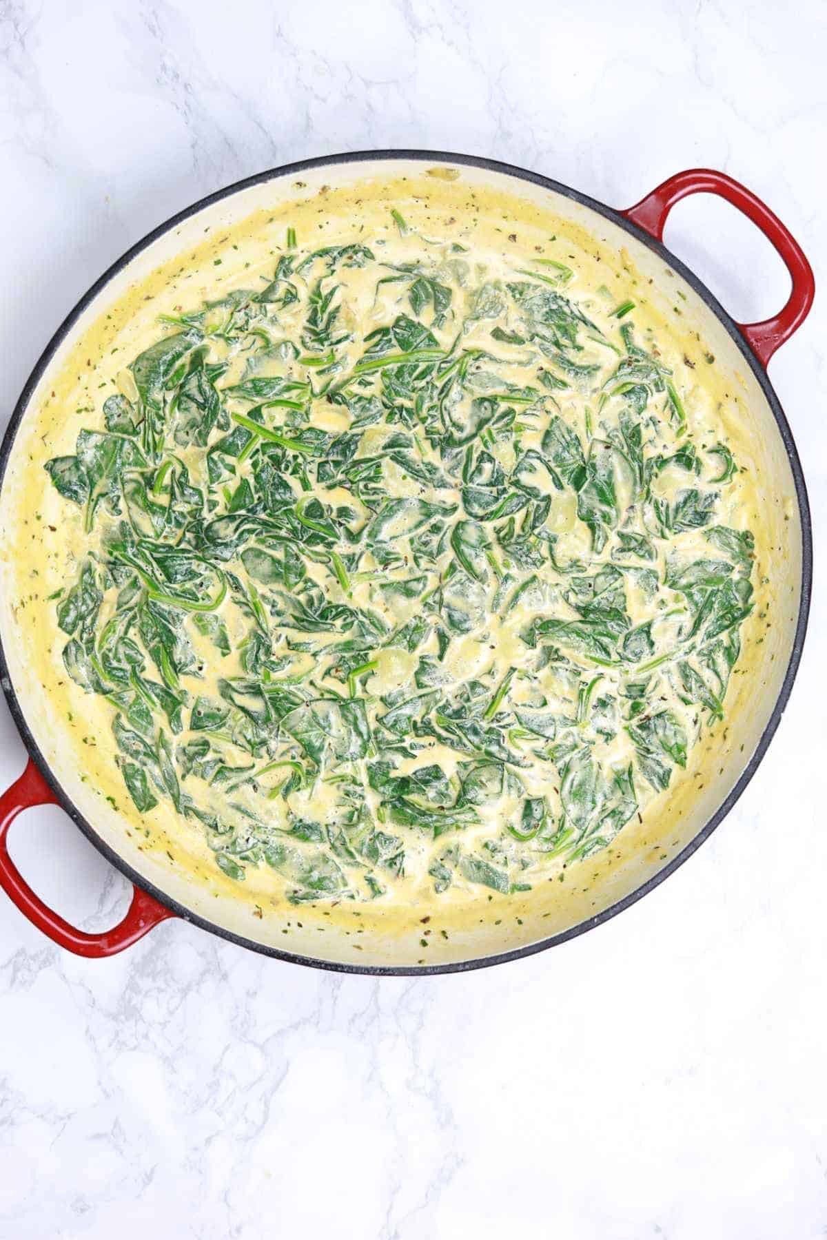 creamy spinach sauce in a pot.