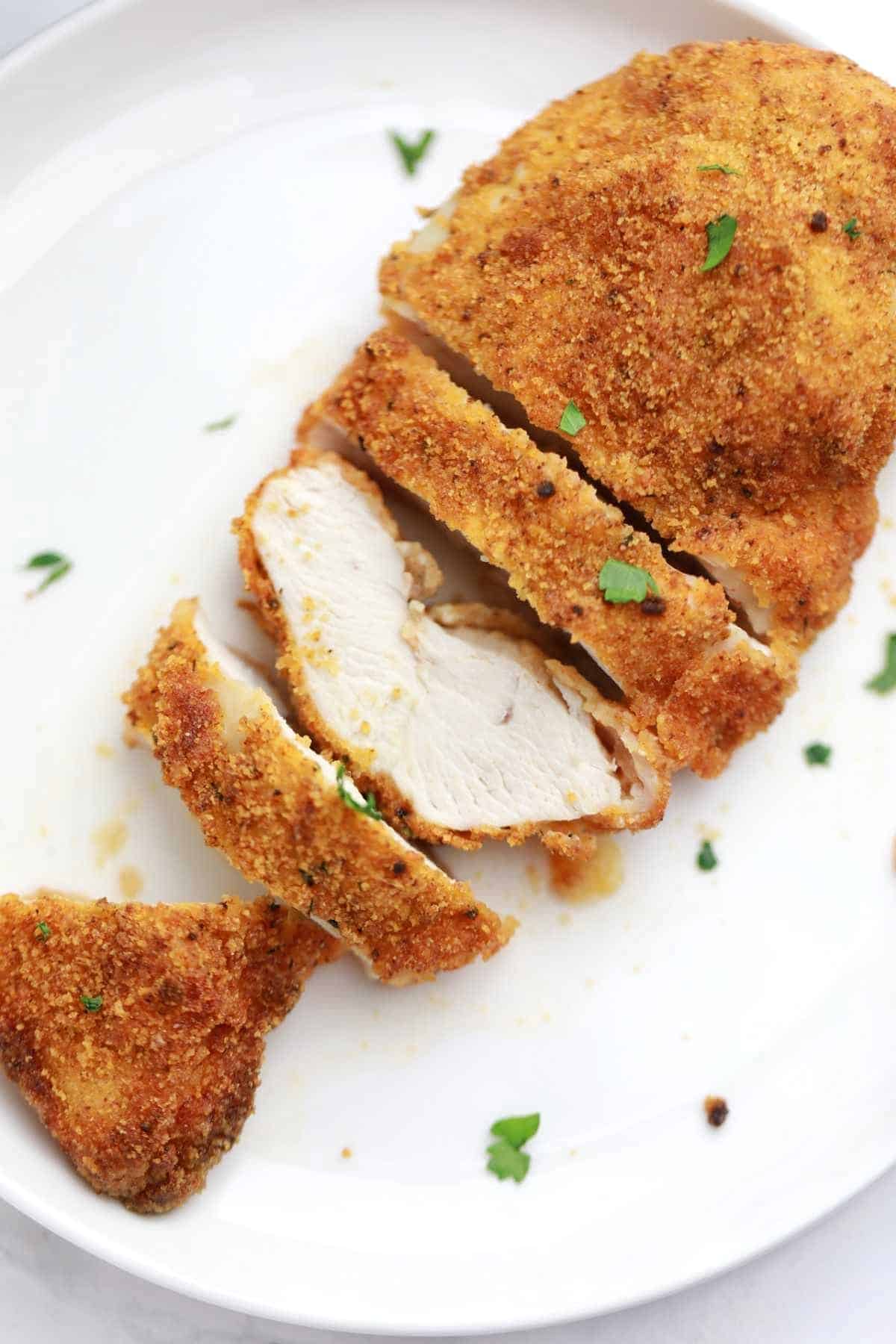 air fryer breaded chicken served on a white plate.