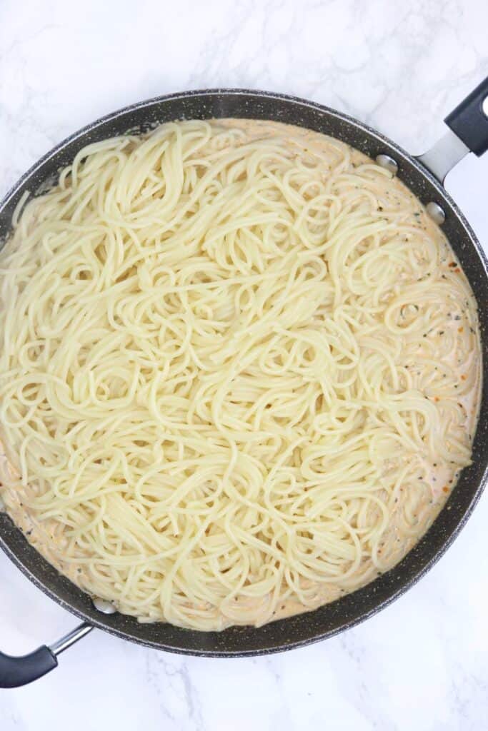sauce and pasta in the skillet.