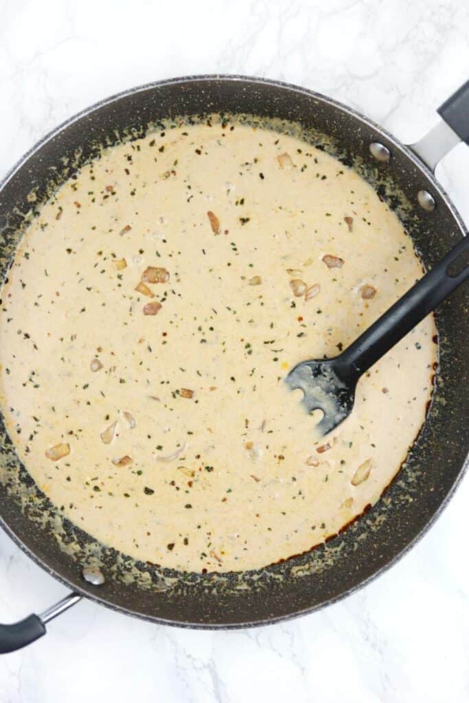 creamy sauce in a skillet.