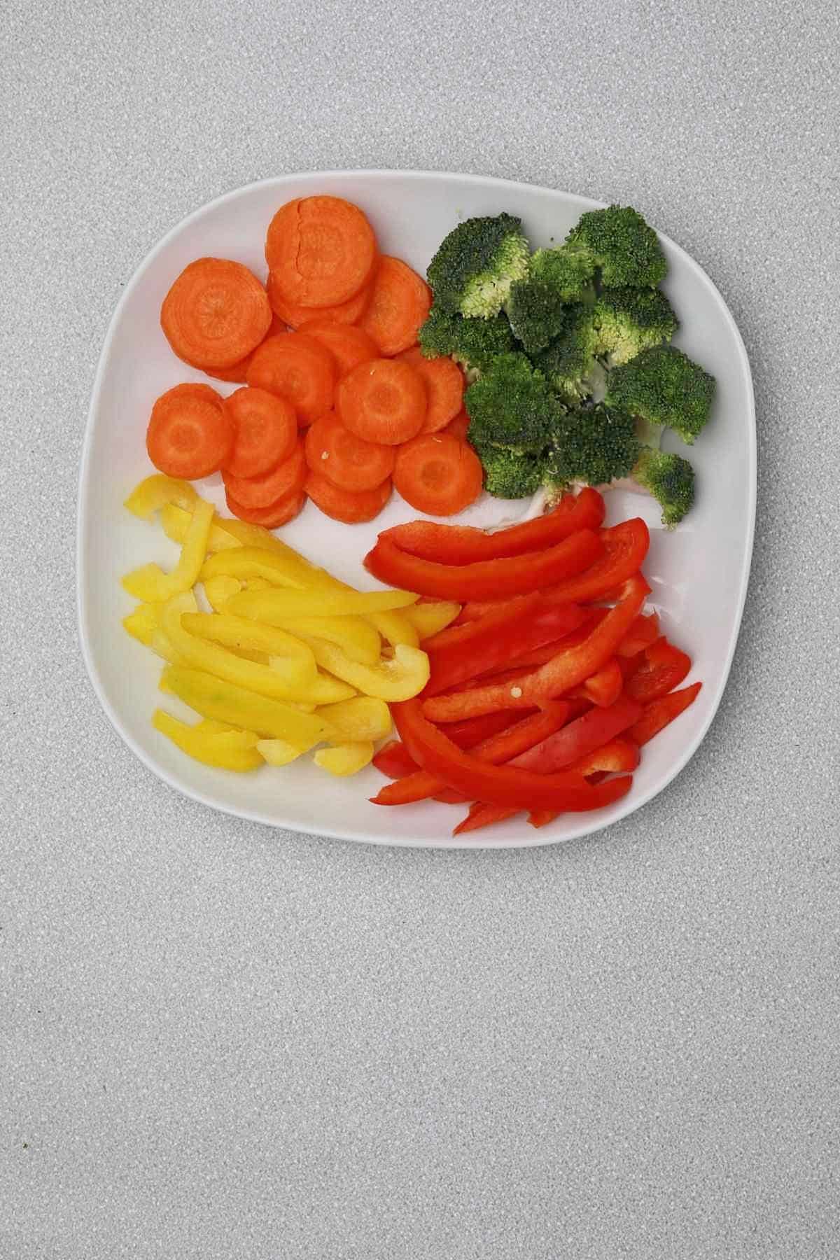 cut vegetables in a white plate.