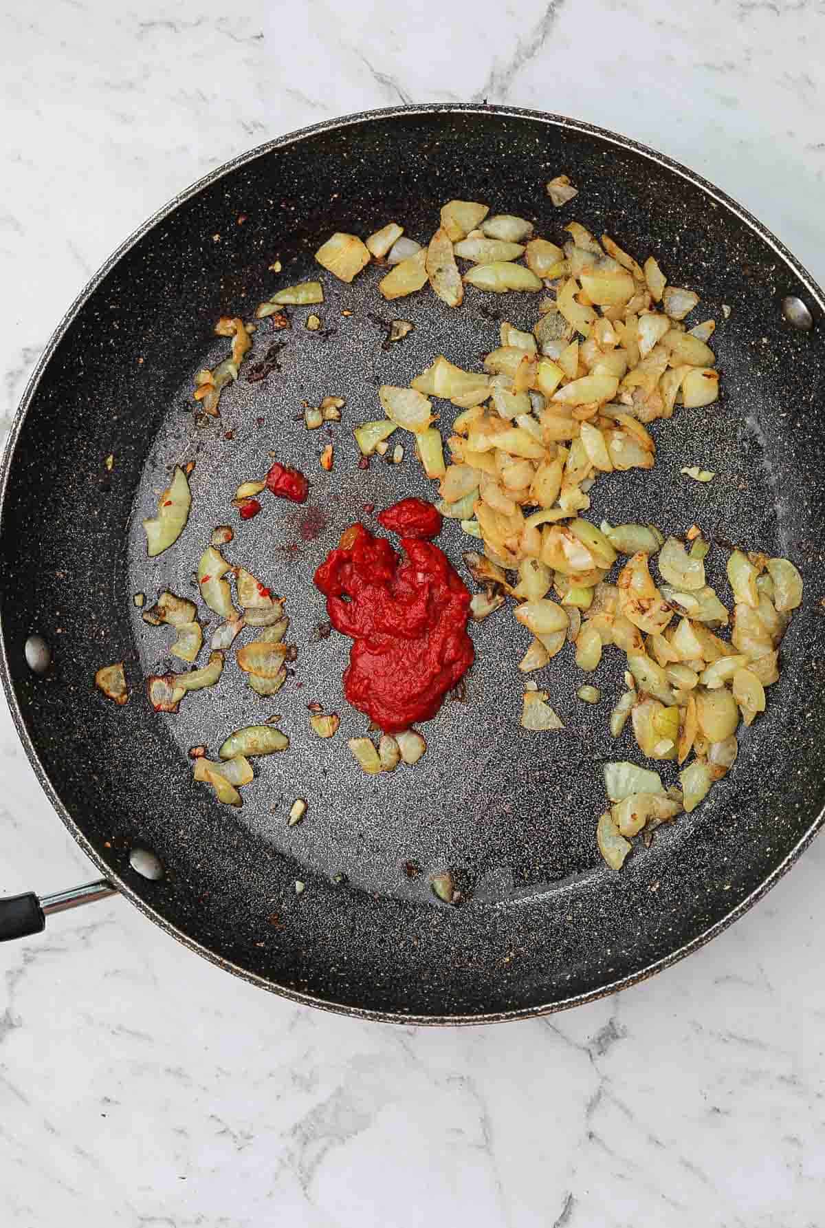 sauteed onions, garlic and tomato paste in the skillet.