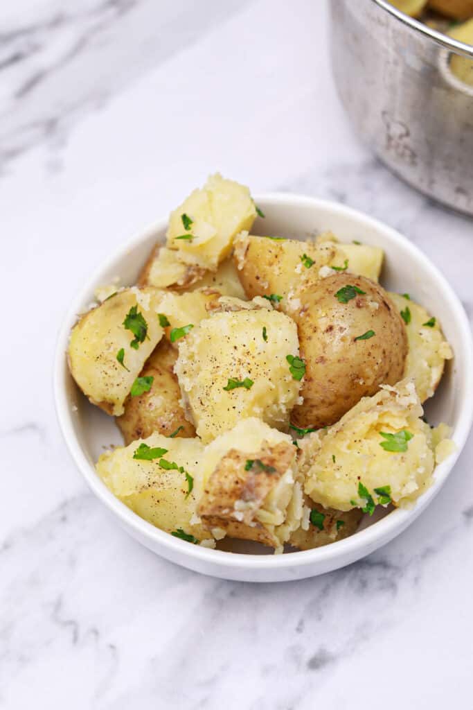 butter potatoes served on a white plate.