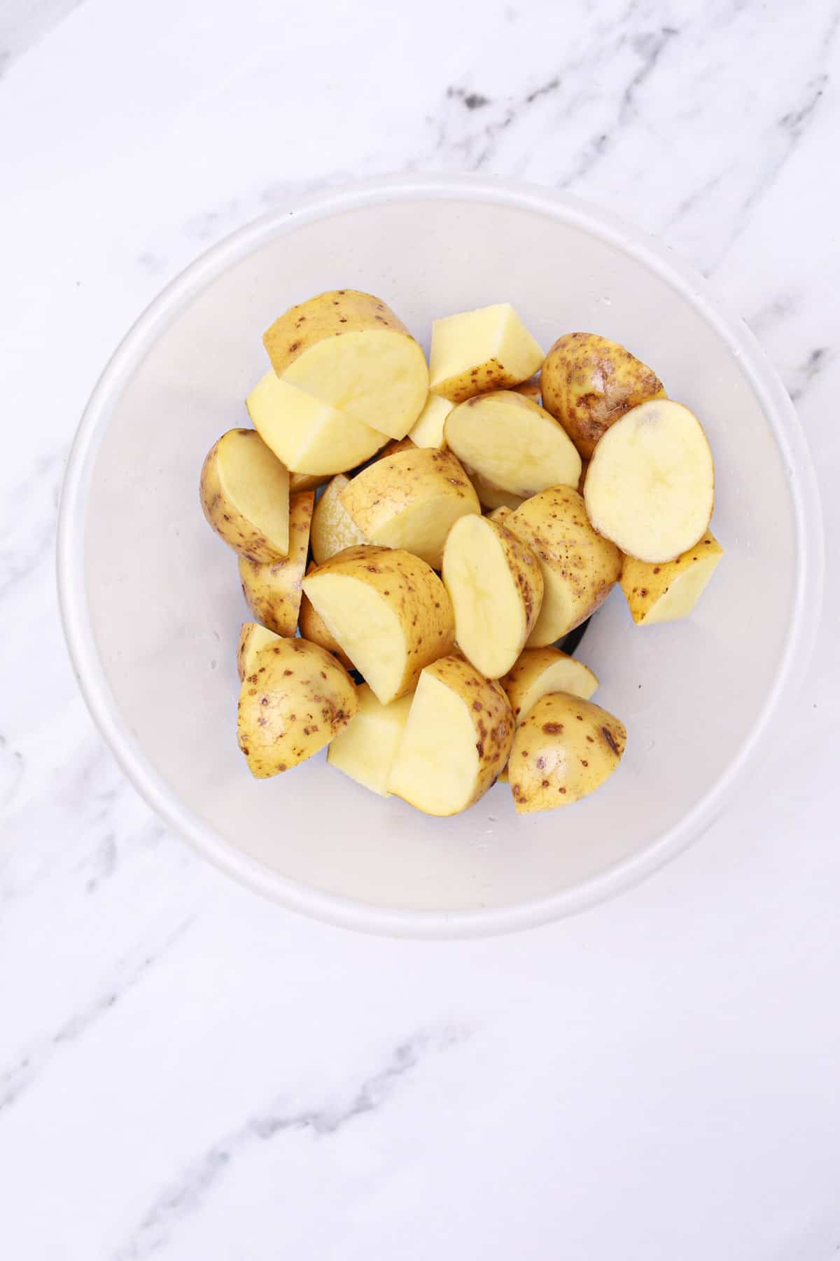 cut potatoes in a bowl.