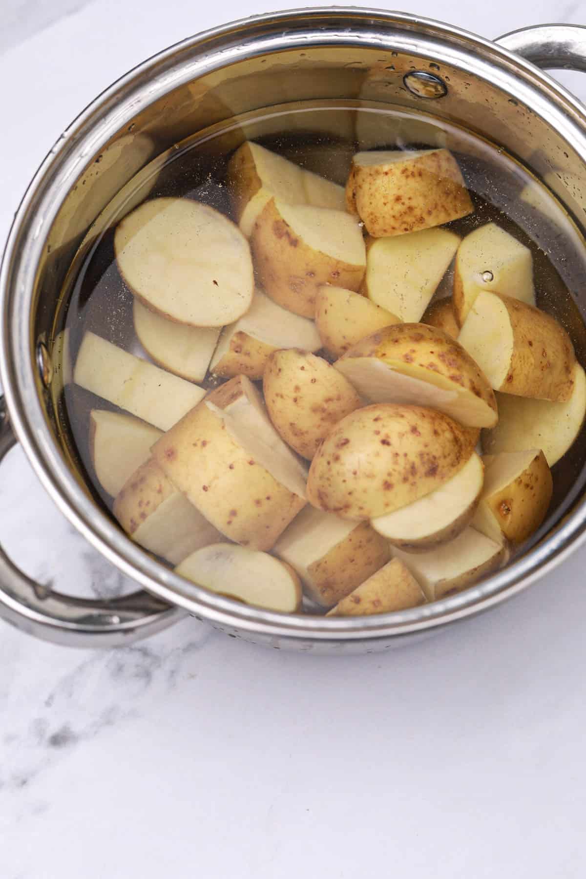 potatoes and water in a pot.