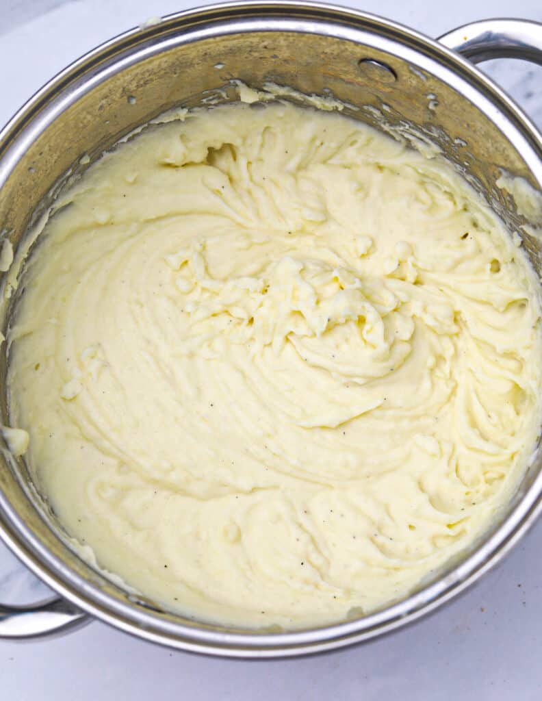 mashed potatoes with cream cheese in a pot.