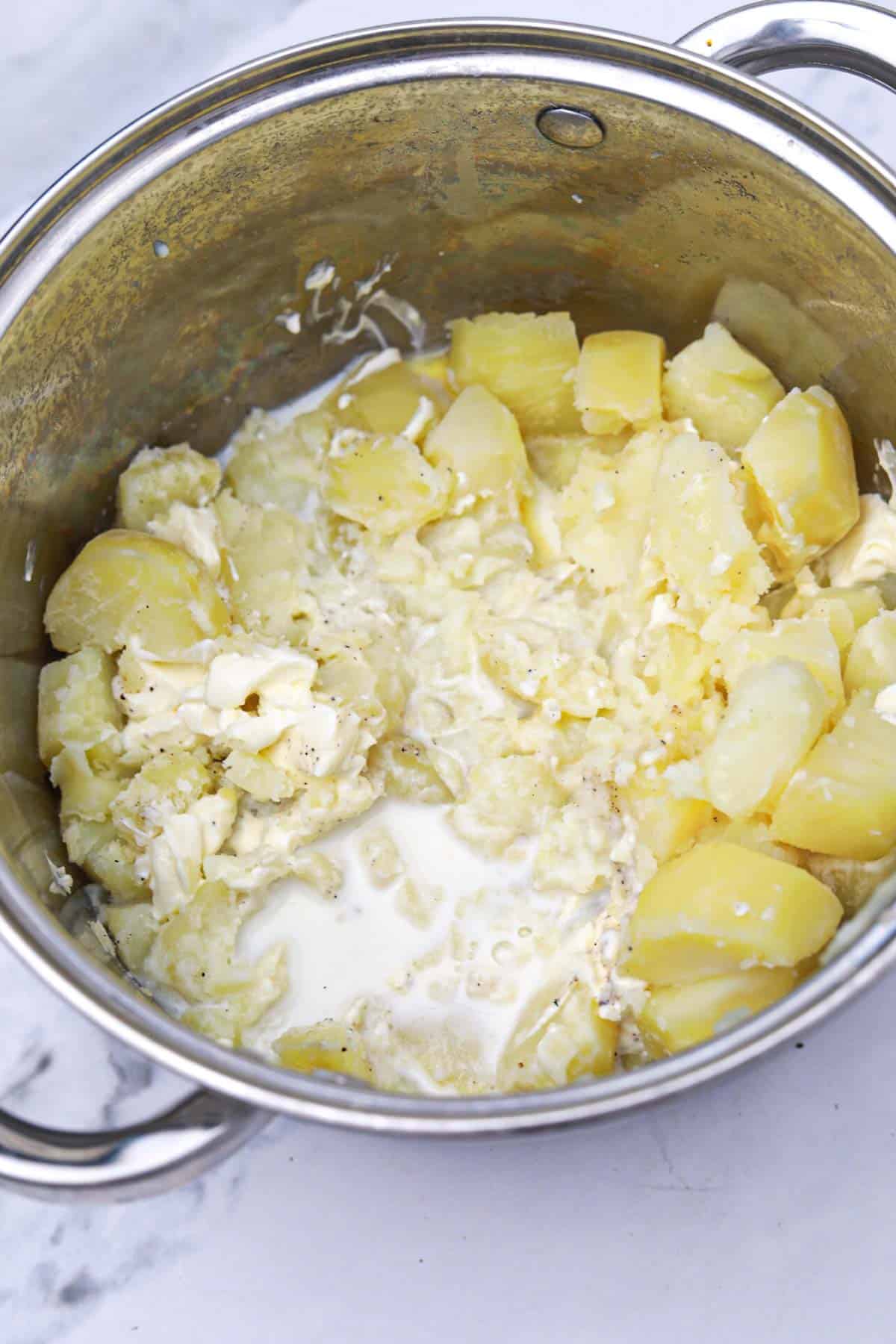 mashed potatoes with cream cheese process shown.