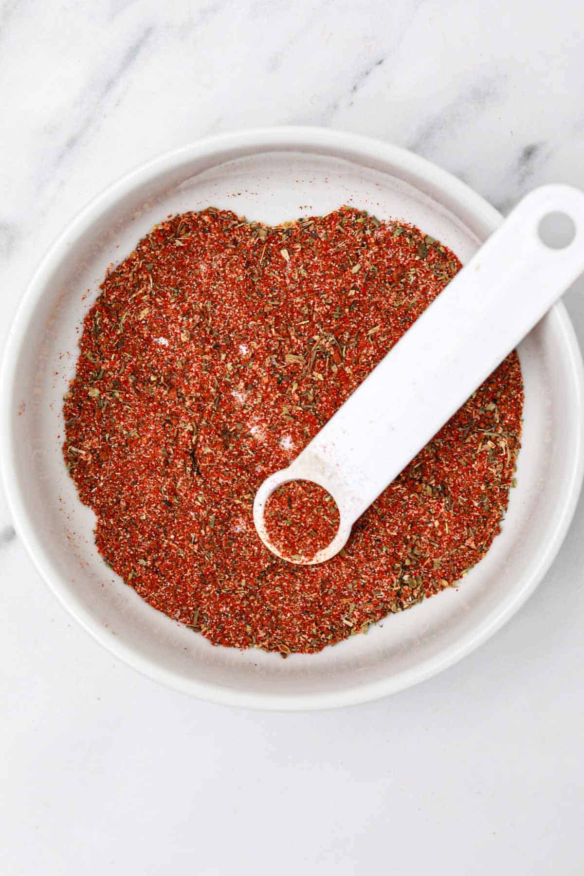 the seasoning in the mixing bowl.