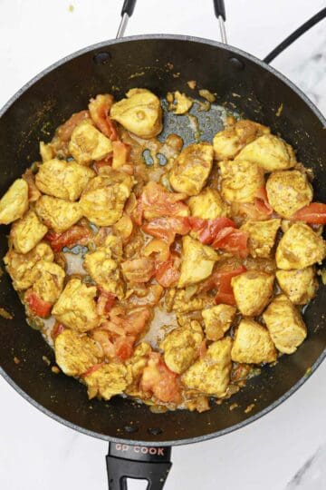 tomatoes added to the pan.