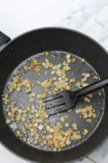 saute onions and garlic in a pan.