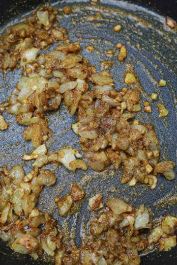 onion, garlic and spices in a pan.