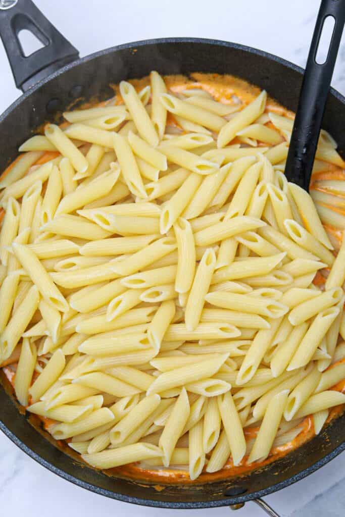 pasta added to the pan.