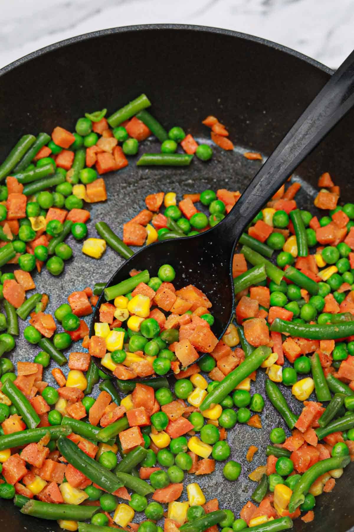 cooking frozen vegetables on the stove.
