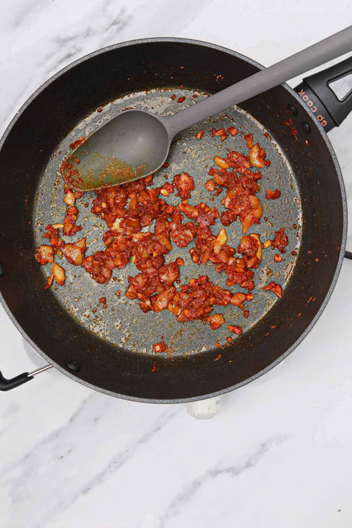 tomato paste with the spices and onions.