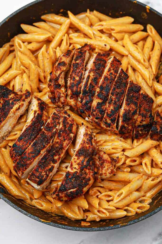 cooked blackened chicken pasta displayed in the pan.