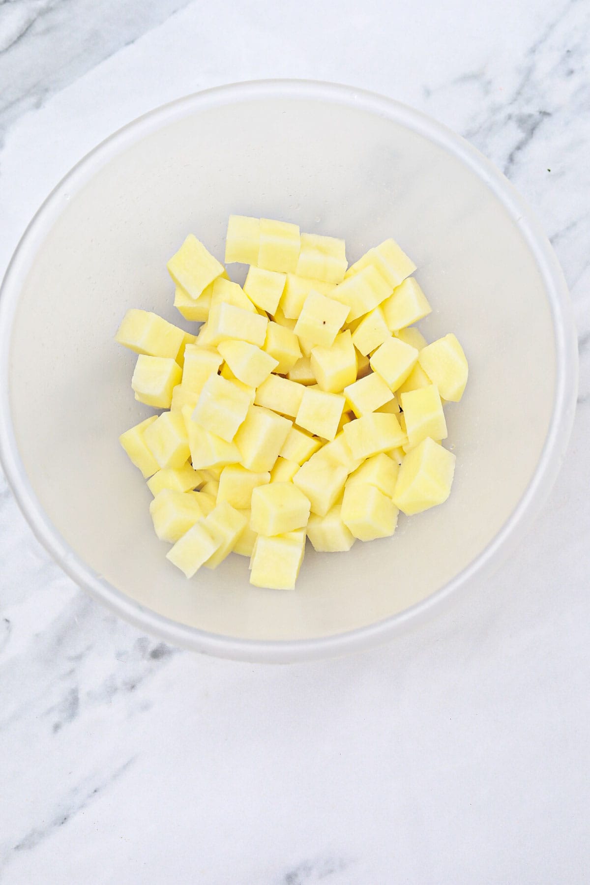 cut potatoes in a bowl.