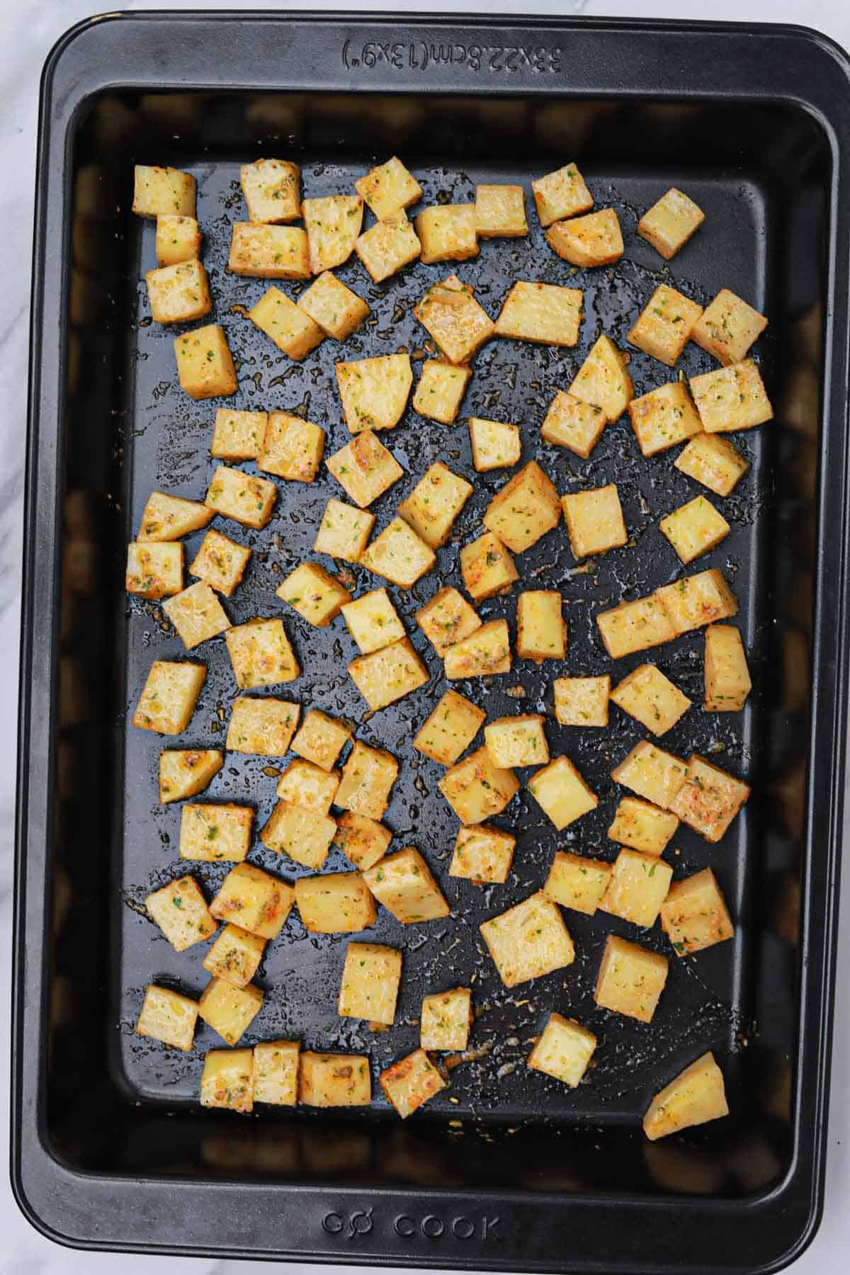 the potatoes transferred to a baking tray.