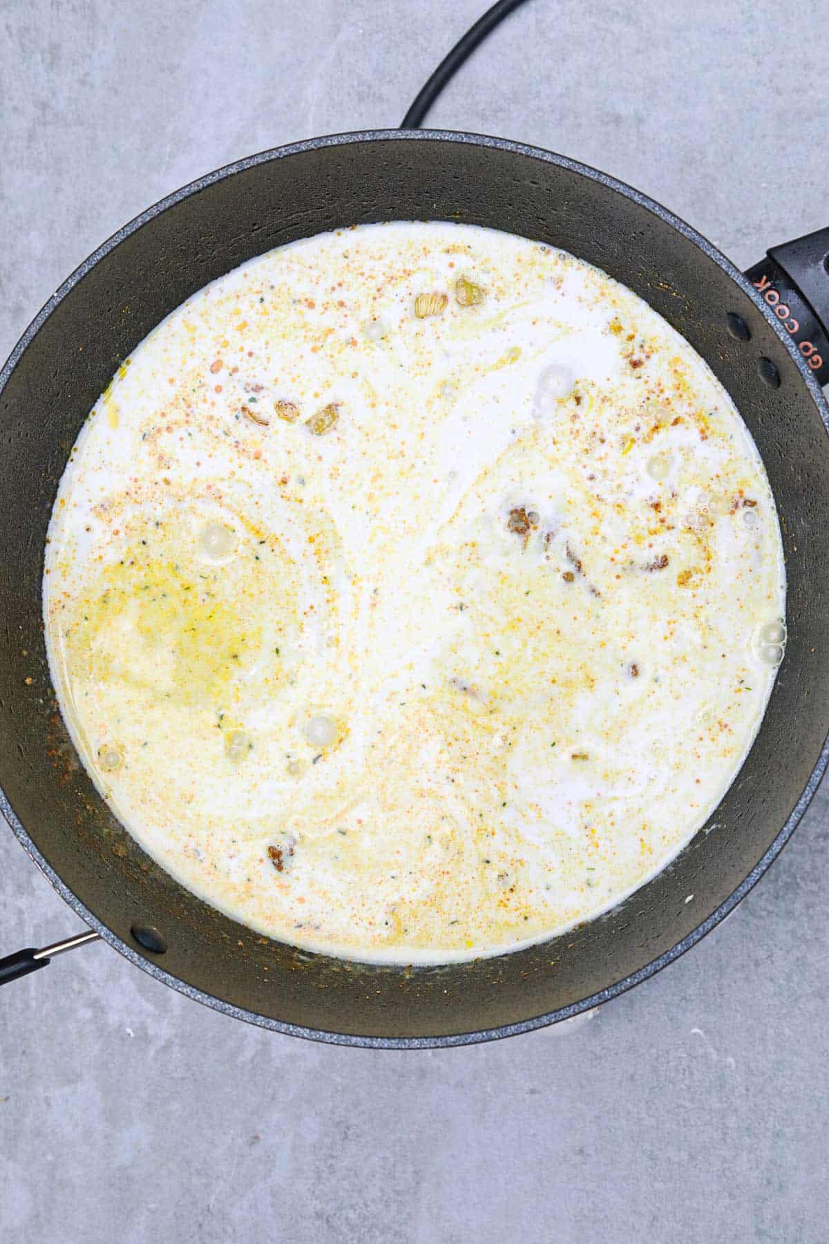 coconut milk added to the skillet.