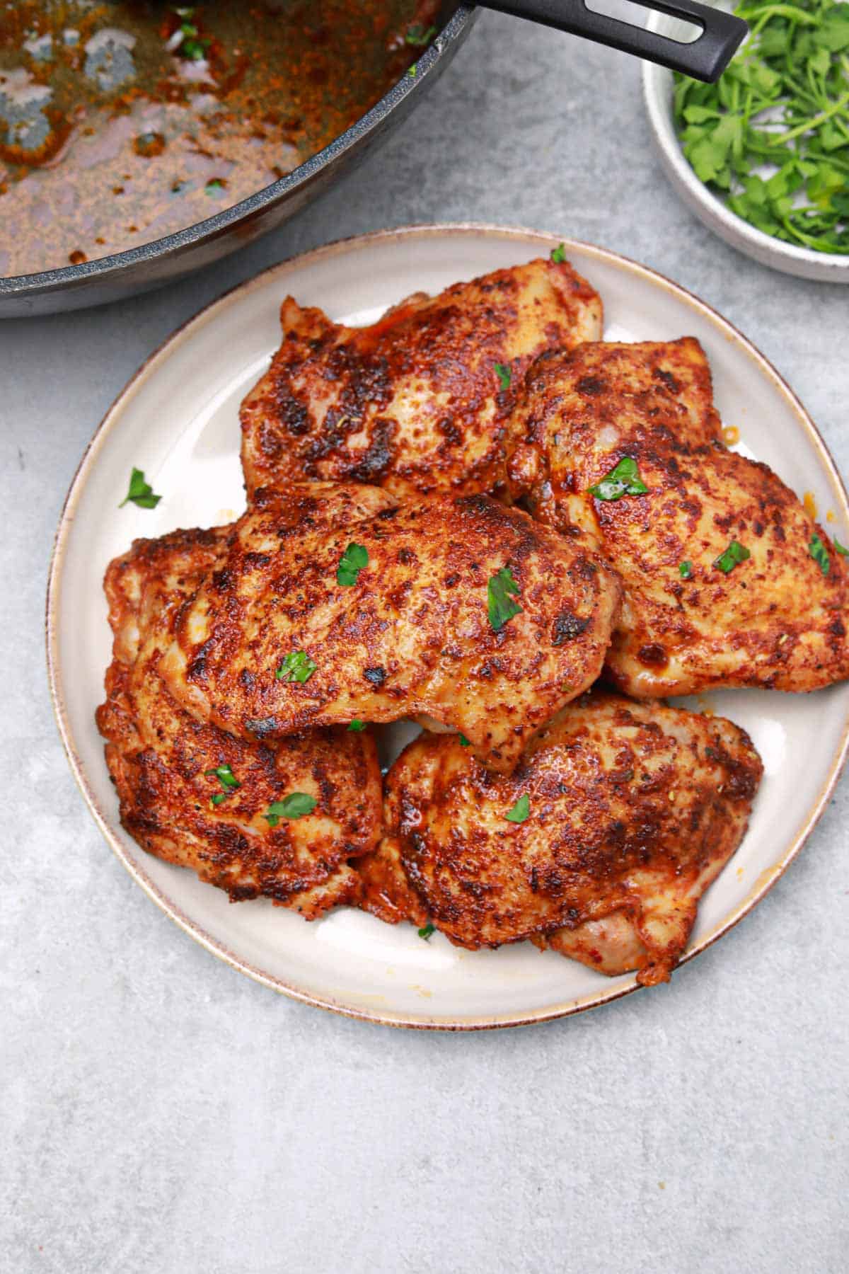 cooked boneless chicken thighs served and displayed.