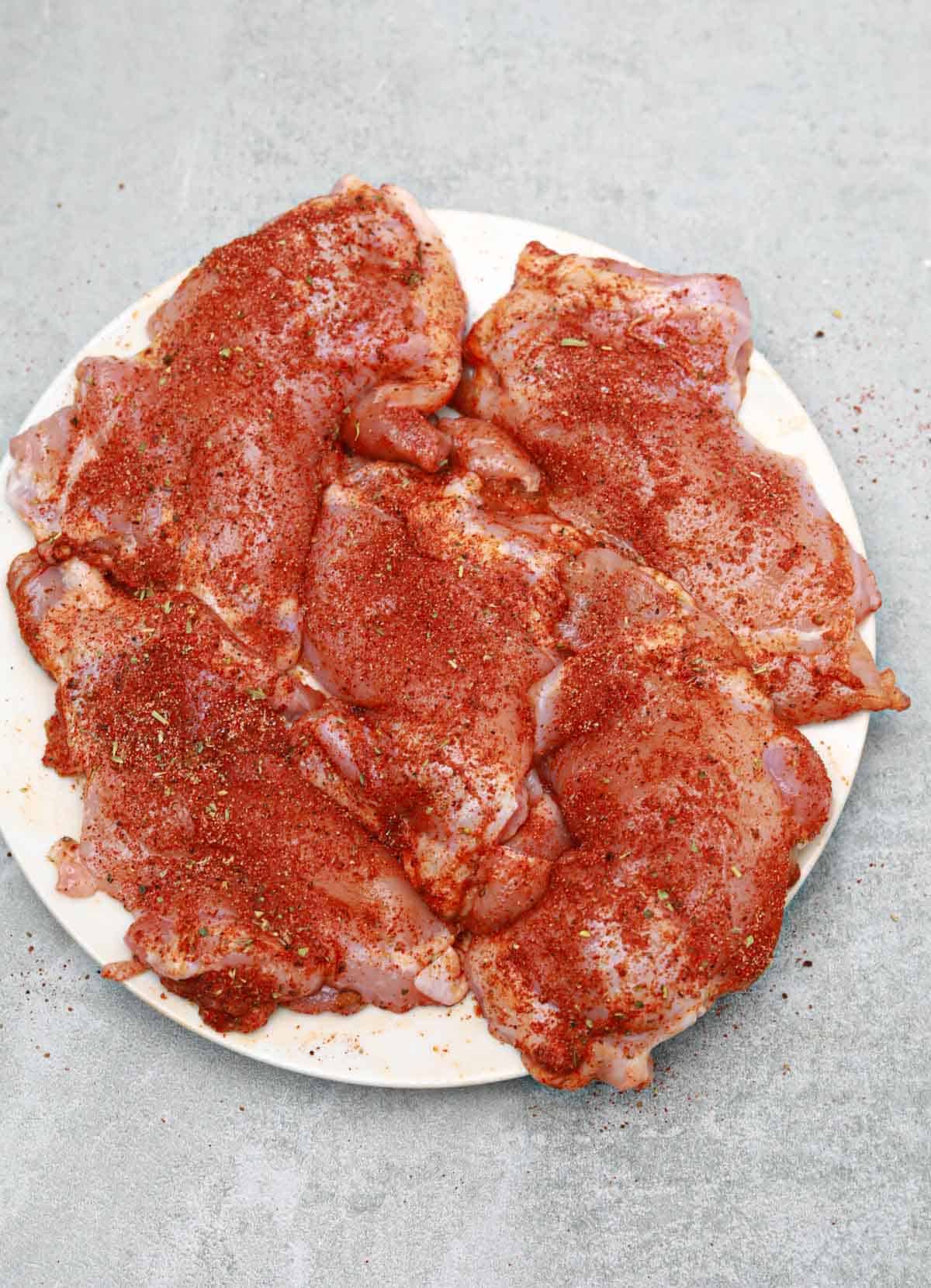 seasoned chicken on a plate.