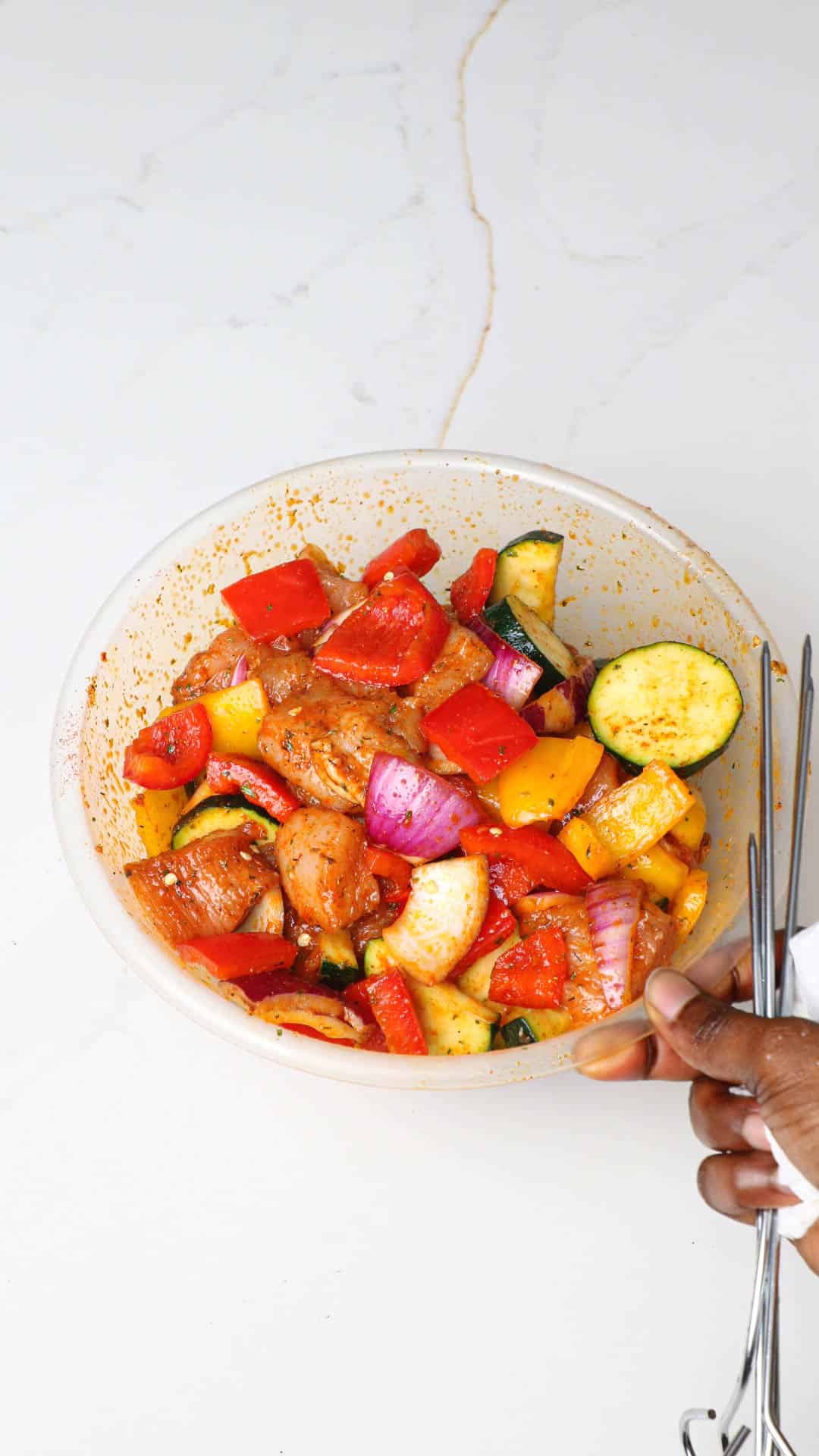seasoned chicken and vegetables in a bowl.