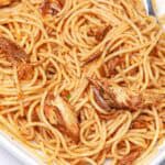 canned mackerel pasta in a white bowl.