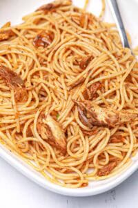 canned mackerel pasta in a white bowl.
